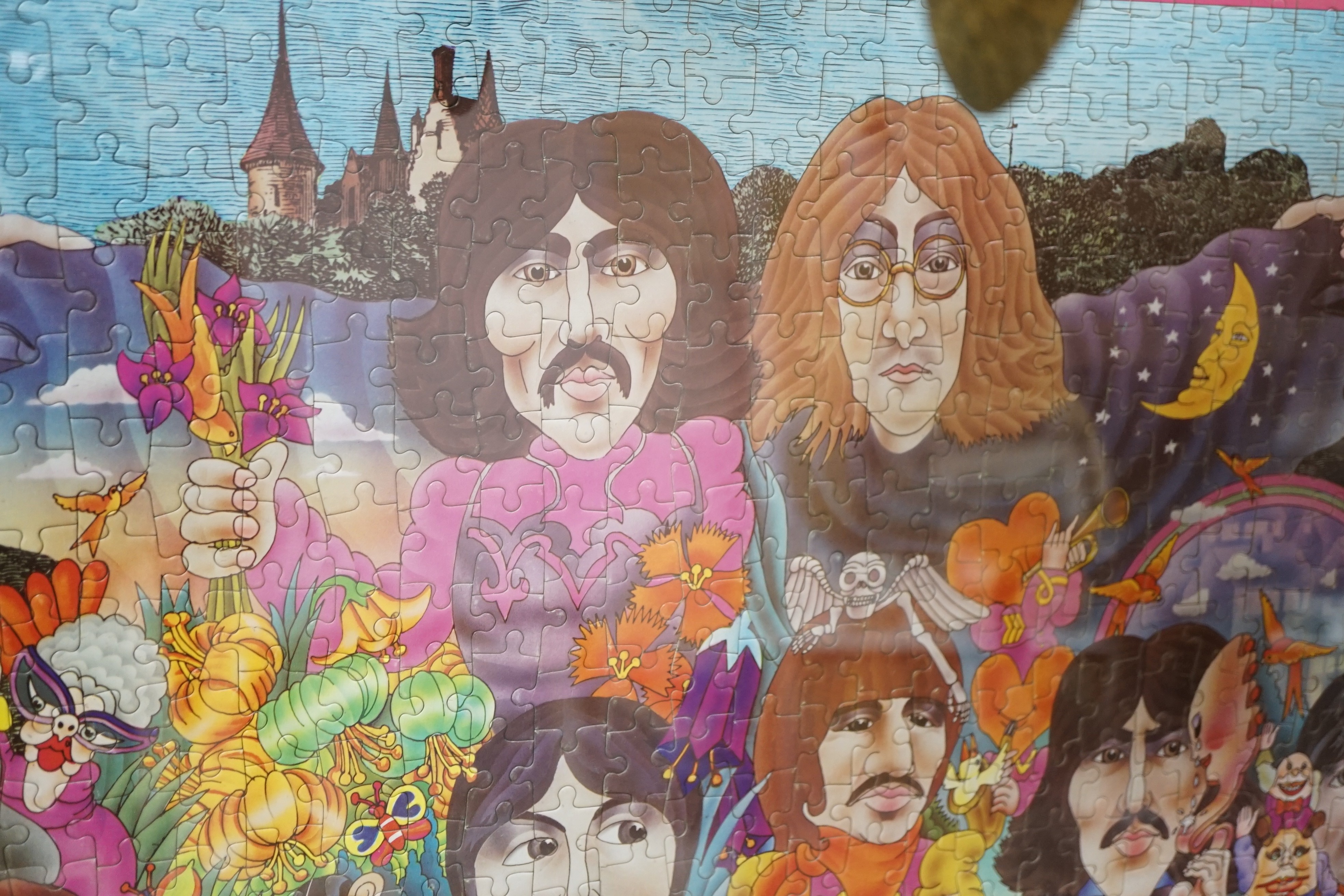 The Beatles Illustrated Lyrics Puzzle in a Puzzle (jigsaw), with colour poster and original box, the puzzle separately framed and glazed